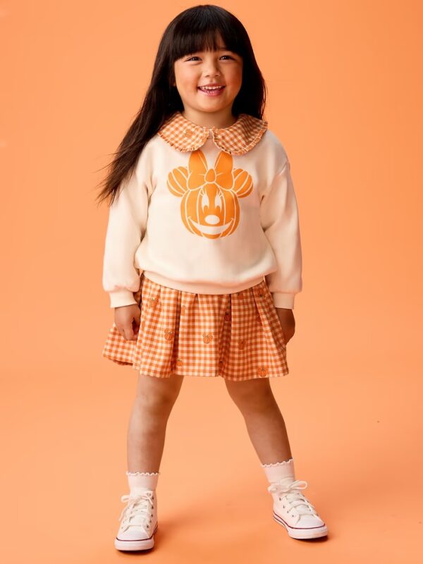 Girl in Minnie Mouse Shirt and skirt