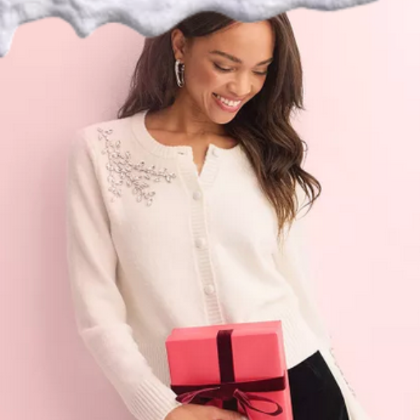 Woman in sweater holding gift